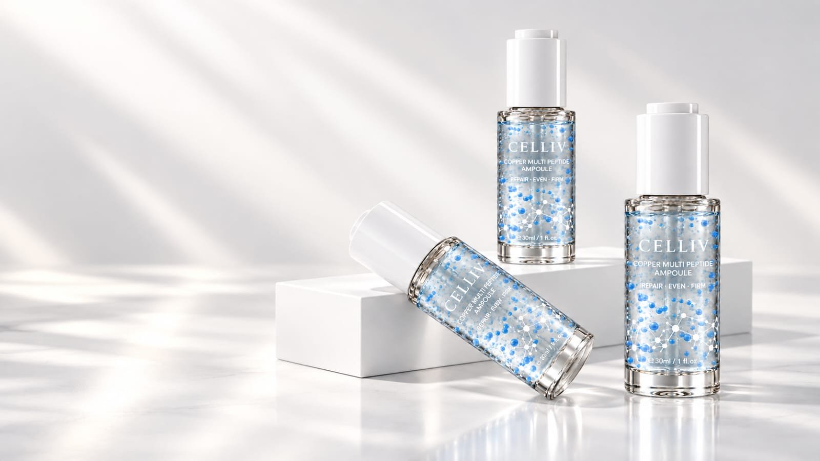 Three CELLIV Copper Multi-Peptide Lifting Ampoule bottles with blue micro-beads on white pedestals
